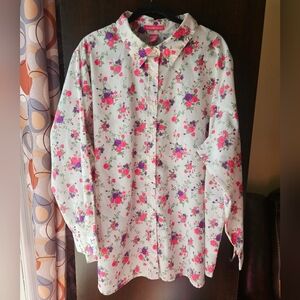 Woman Within Floral Blouse with Pink and Purple Accents
